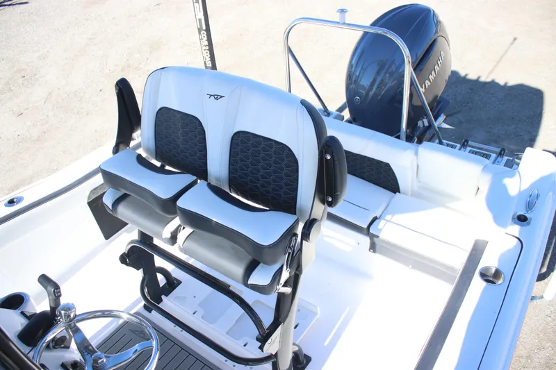 Slide: The Image of 2026 Tidewater 220 LXF boat interior with dual seats and Yamaha engine. - 12