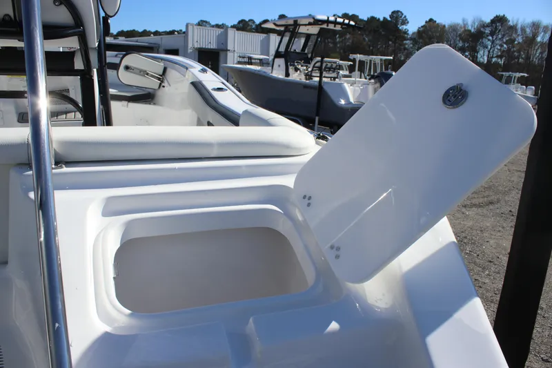 Slide: The Image of 2026 Tidewater 220 LXF boat interior with open storage compartment. - 18