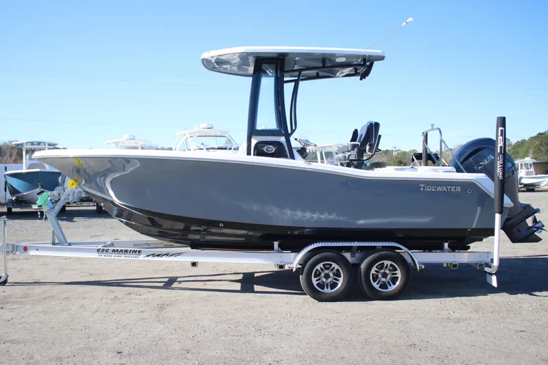 Slide: The Image of 2026 Tidewater 220 LXF boat on trailer, side view, outdoors. - 2