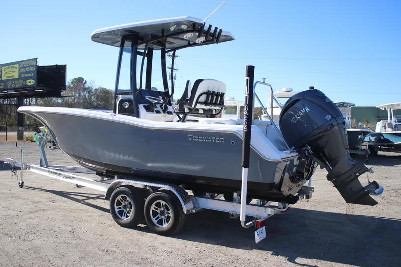 Slide: The Image of 2026 Tidewater 220 LXF boat on trailer with Yamaha outboard motor, parked outdoors. - 3