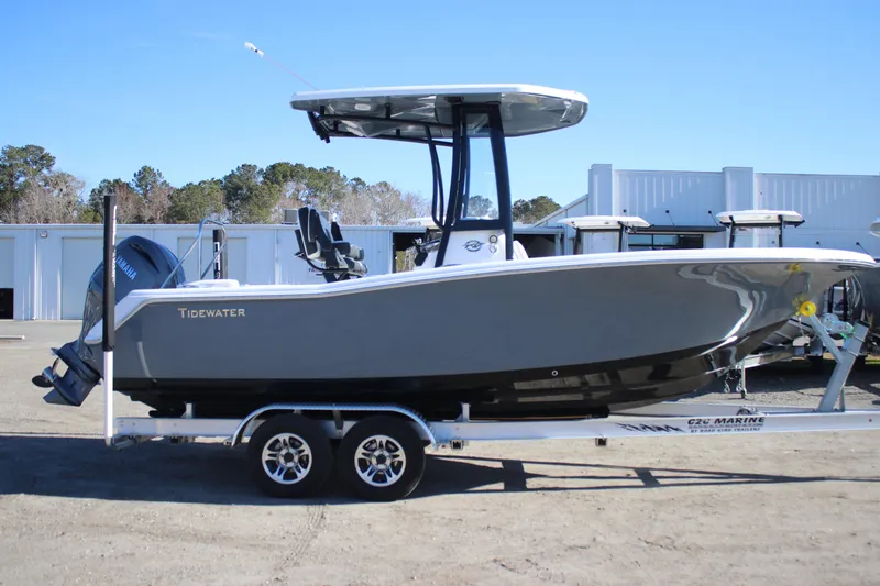 Slide: The Image of 2026 Tidewater 220 LXF boat on trailer, parked outdoors. - 5