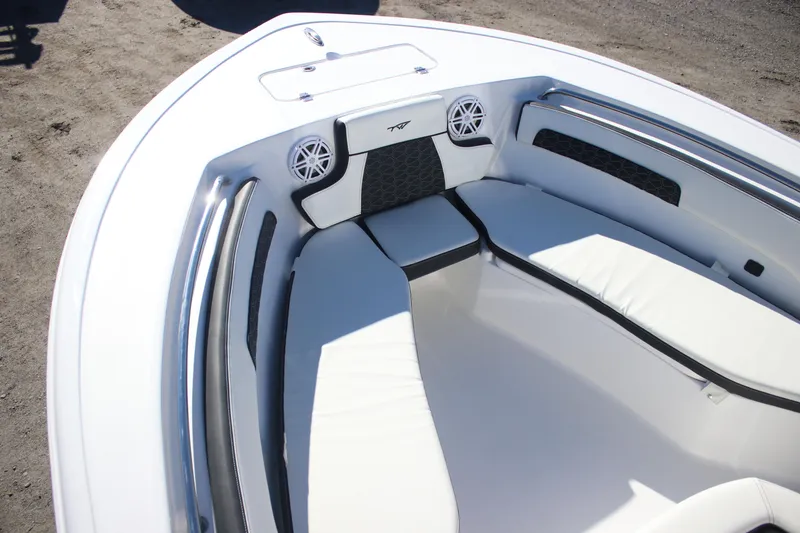Slide: The Image of 2026 Tidewater 220 LXF boat interior with white cushioned seating and sleek design. - 9
