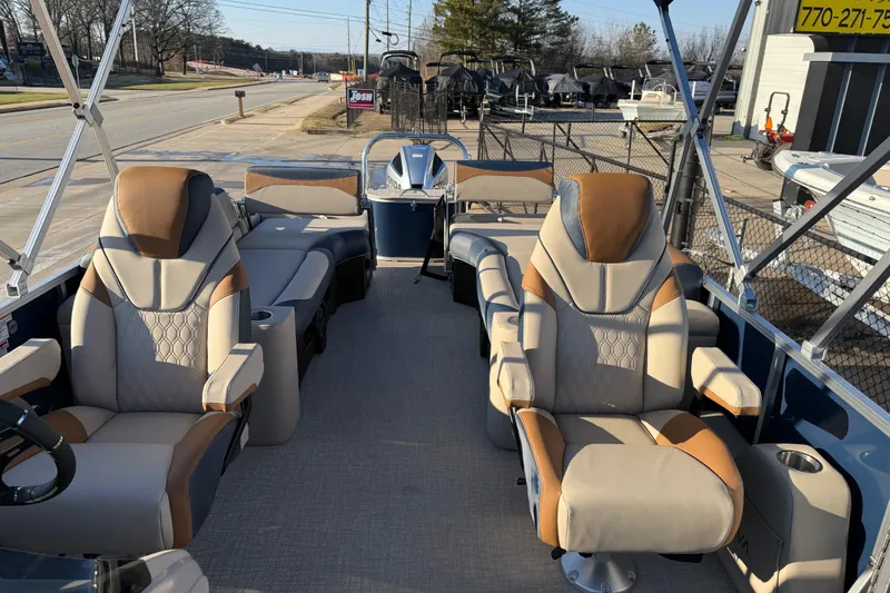 Slide: The Image of Luxurious 2026 Avalon LSZ Quad Lounger Shift pontoon boat with plush seating and modern design. - 10