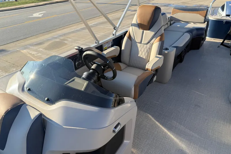 Slide: The Image of 2026 Avalon LSZ Quad Lounger Shift boat interior with luxurious seating and steering console. - 11
