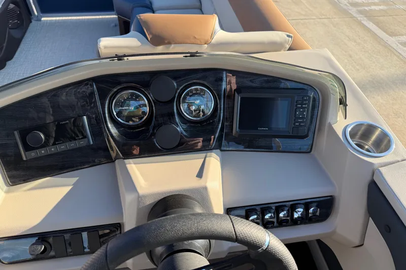 Slide: The Image of 2026 Avalon LSZ Quad Lounger Shift dashboard with gauges, controls, and Garmin display. - 15