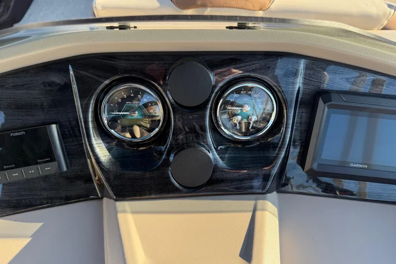 Slide: The Image of Dashboard of 2026 Avalon LSZ Quad Lounger Shift with gauges and Garmin display. - 17