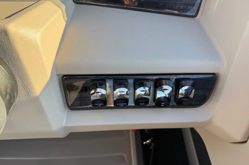 Slide: The Image of Control panel of 2026 Avalon LSZ Quad Lounger Shift with labeled switches. - 19