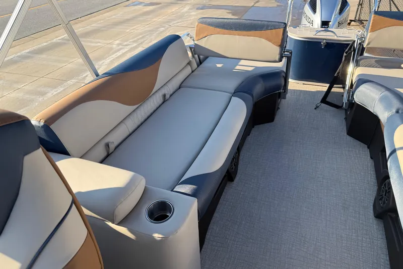 Slide: The Image of 2026 Avalon LSZ Quad Lounger Shift boat interior with stylish seating and cup holder. - 21