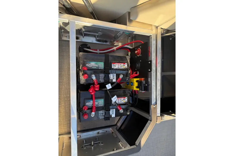 Slide: The Image of Battery compartment of 2026 Avalon LSZ Quad Lounger Shift with wiring and connections. - 32
