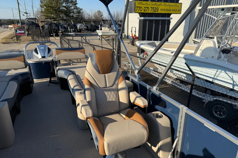 Slide: The Image of Luxurious seating on 2026 Avalon LSZ Quad Lounger Shift pontoon boat at dealership. - 9