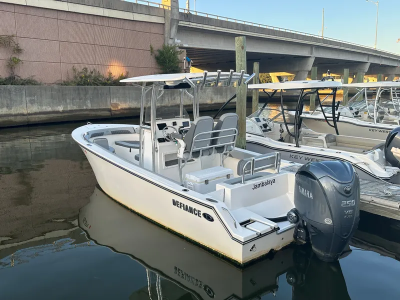 Slide: The Image of 2024 Defiance 240 Catalina boat docked with Yamaha engine. - 1