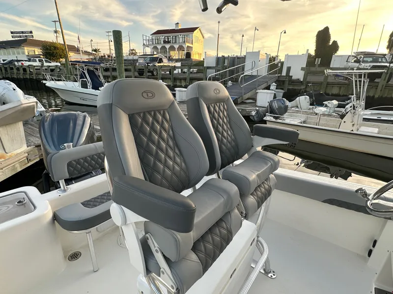 Slide: The Image of Luxurious seating on a 2024 Defiance 240 Catalina boat. - 15