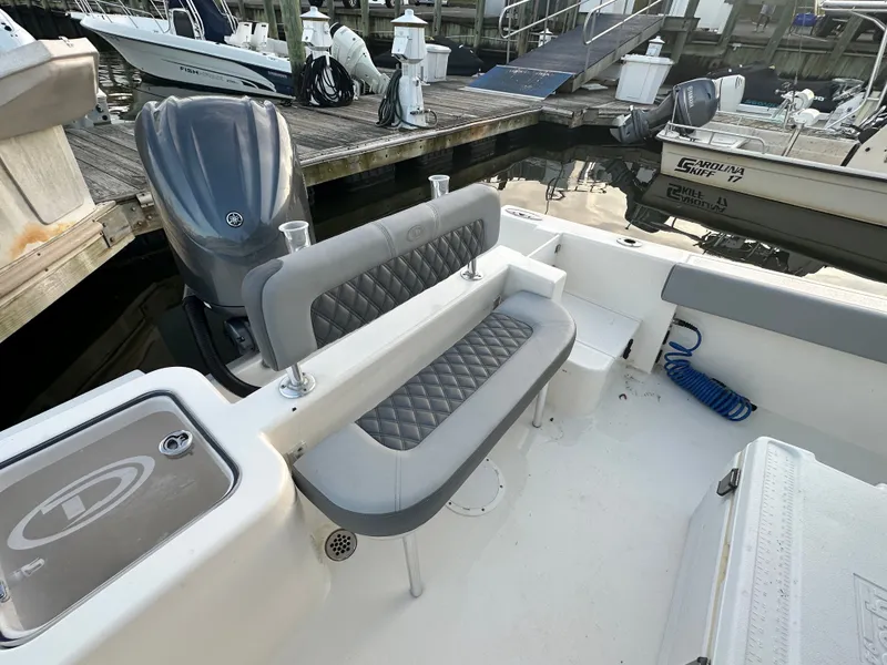 Slide: The Image of Interior of 2024 Defiance 240 Catalina boat at dock. - 17