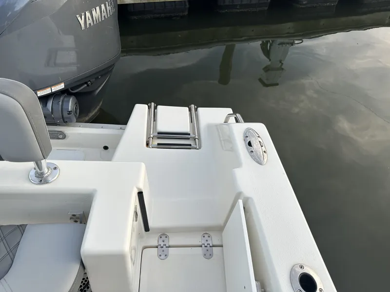 Slide: The Image of Defiance 240 Catalina 2024 boat with Yamaha engine at dock. - 19