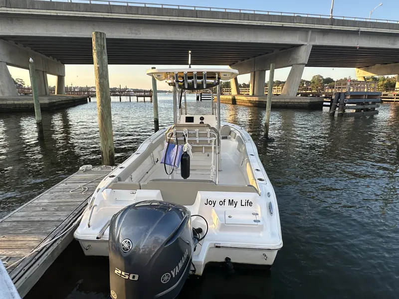 Slide: The Image of 2024 Key West 239 FS boat docked under bridge. - 2