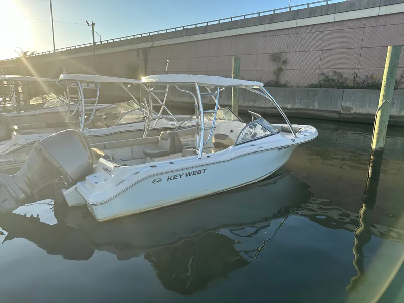 The Image of 2024 Key West 239 DFS boat docked in water at sunset. - 0