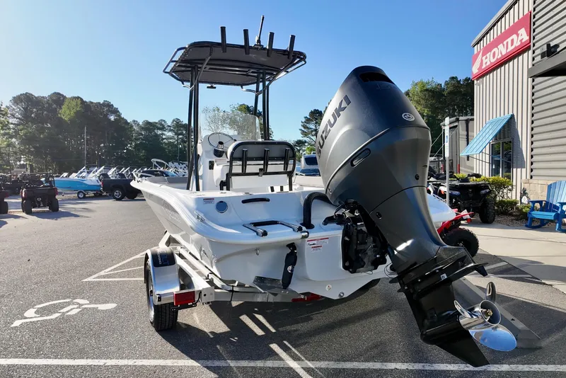 Slide: The Image of 2026 ALK2 Powerboats 23 CRX with Suzuki engine at dealership parking lot. - 12