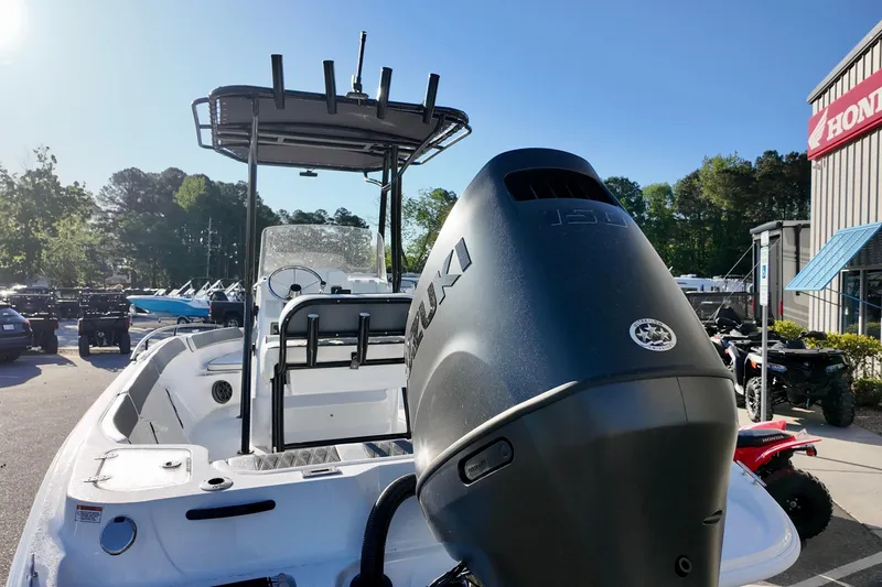 Slide: The Image of 2026 ALK2 Powerboats 23 CRX with Suzuki outboard motor in dealership lot. - 13