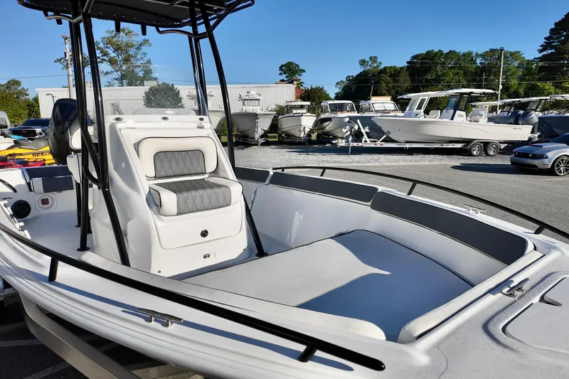 Slide: The Image of 2026 ALK2 Powerboats 23 CRX, sleek white design, spacious seating, outdoor display. - 15