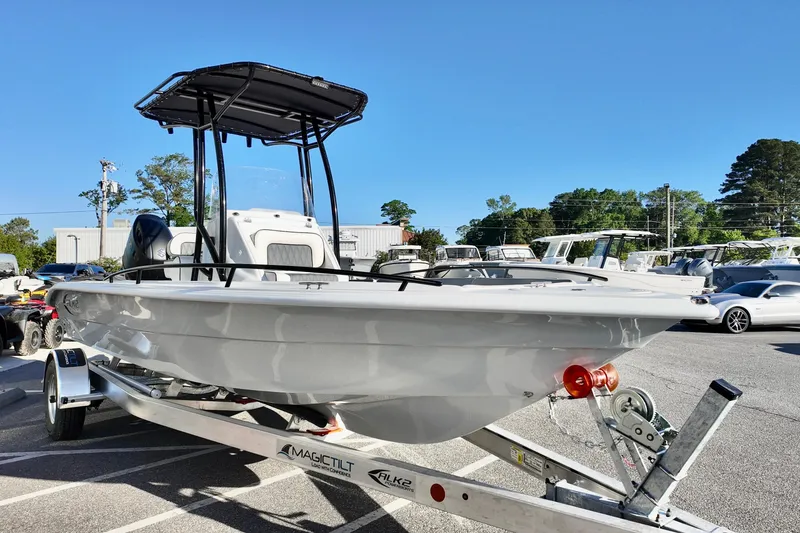 Slide: The Image of 2026 ALK2 Powerboats 23 CRX on trailer, parked outdoors under clear blue sky. - 16