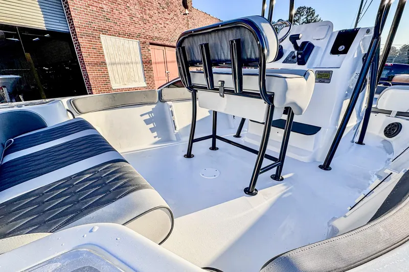 Slide: The Image of 2026 ALK2 23 CRX boat interior with modern seating and steering console. - 3