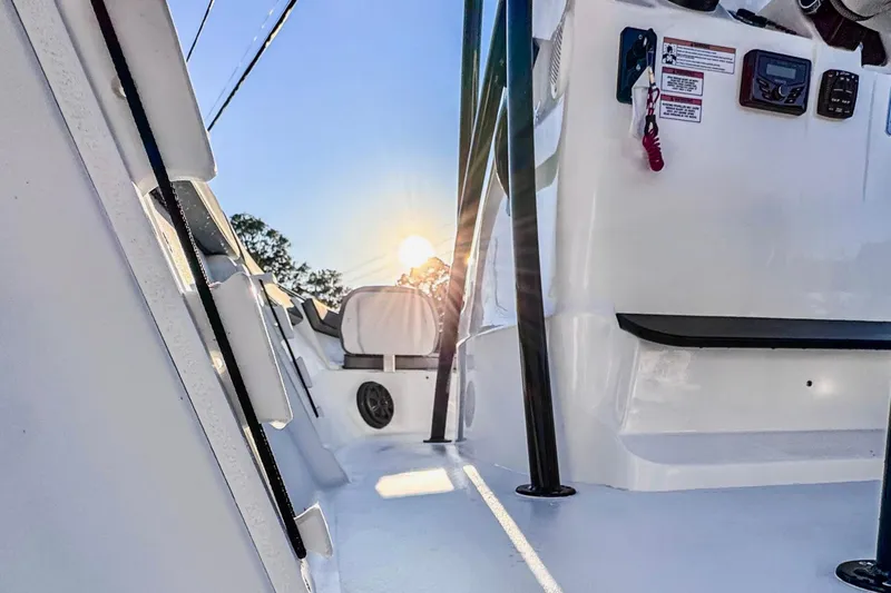 Slide: The Image of Interior view of ALK2 23 CRX boat, 2026 model, with sunlight and sleek design. - 6