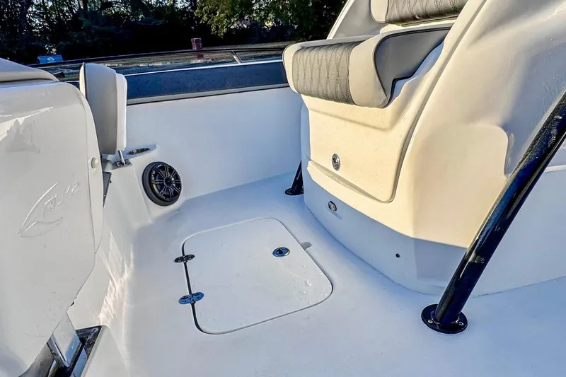 Slide: The Image of Interior of 2026 ALK2 23 CRX boat featuring seating and speaker system. - 8