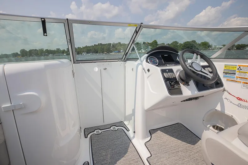 Slide: The Image of Manufacturer Provided Image: 2021 Hurricane SunDeck 2400 OB boat cockpit with steering wheel and control panel. - 10