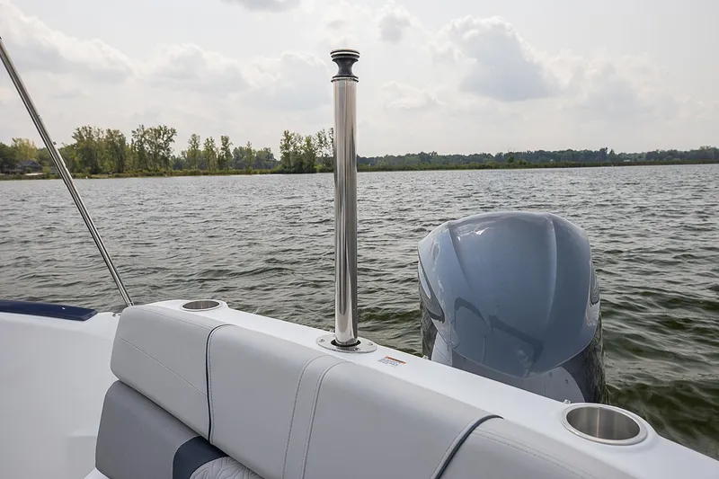 Slide: The Image of Manufacturer Provided Image: 2021 Hurricane SunDeck 2400 OB boat on a lake with scenic background. - 13