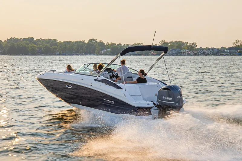 Slide: The Image of Manufacturer Provided Image: 2021 Hurricane SunDeck 2400 OB boat cruising on a lake at sunset. - 3