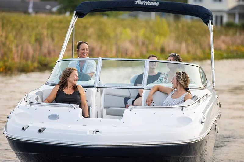 Slide: The Image of Manufacturer Provided Image: 2021 Hurricane SunDeck 2400 OB boat with people enjoying a sunny day on the water. - 5