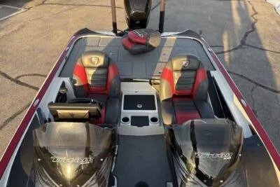 Slide: The Image of 2015 Triton 22 TrX boat interior with dual seats and console. - 7