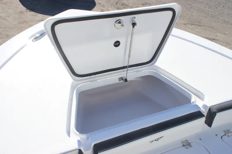 Slide: The Image of Open storage compartment on 2026 Tidewater 2300 Carolina Bay boat deck. - 12