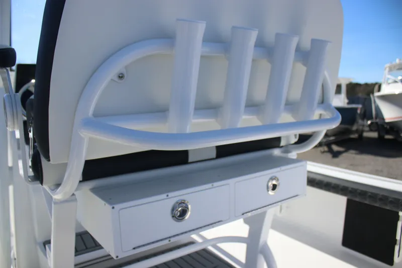 Slide: The Image of 2026 Tidewater 2300 Carolina Bay boat seat with rod holders and storage drawers. - 18