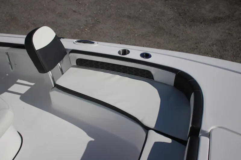 Slide: The Image of 2026 Tidewater 2300 Carolina Bay boat interior seating with cup holders and sleek design. - 19