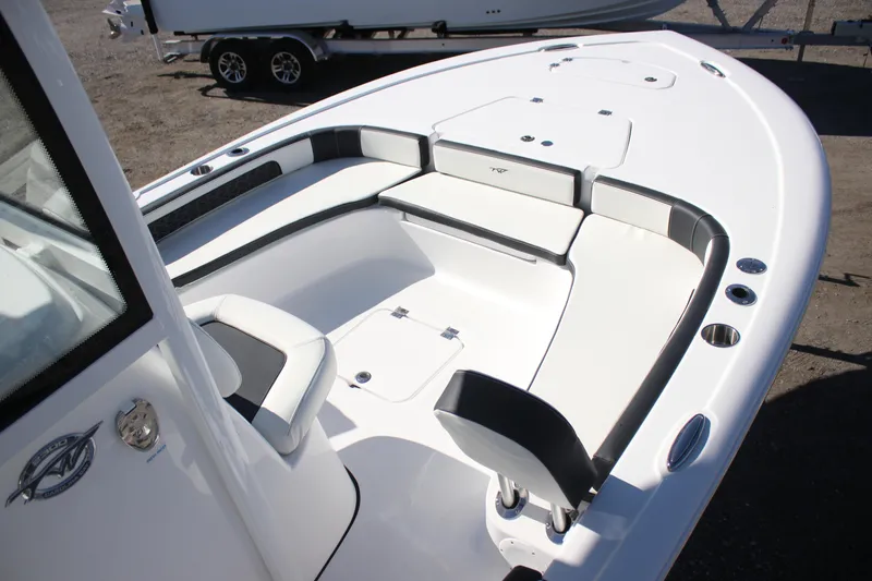 Slide: The Image of 2026 Tidewater 2300 Carolina Bay boat interior with sleek seating and storage compartments. - 25