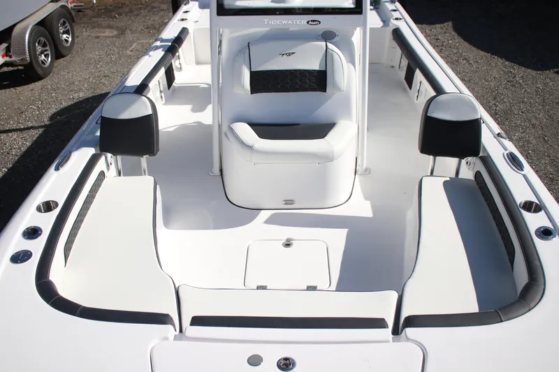 Slide: The Image of 2026 Tidewater 2300 Carolina Bay boat interior with white seating and modern design. - 26