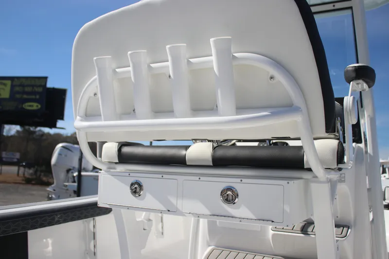 Slide: The Image of 2026 Tidewater 2300 Carolina Bay boat seat with rod holders and storage drawers. - 29