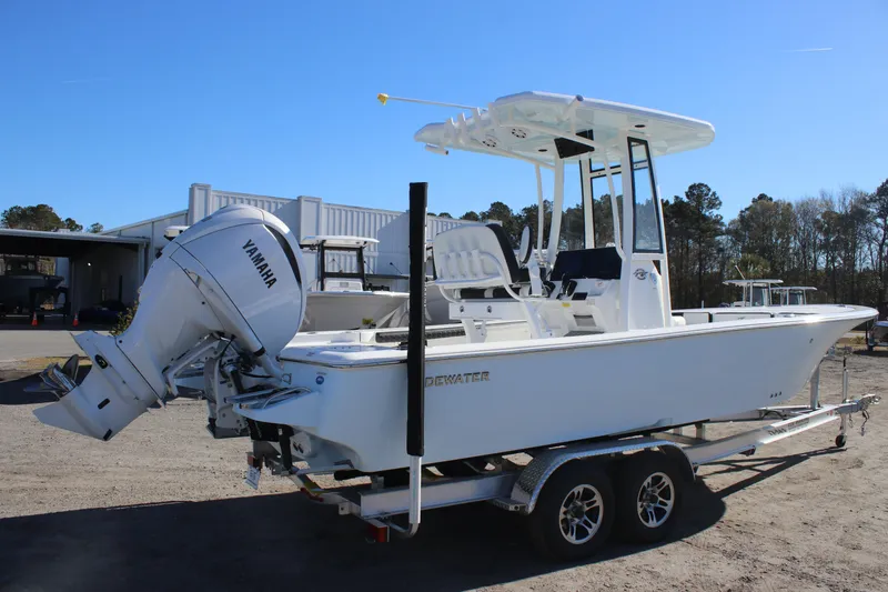 Slide: The Image of 2026 Tidewater 2300 Carolina Bay boat with Yamaha engine on trailer, outdoors. - 3
