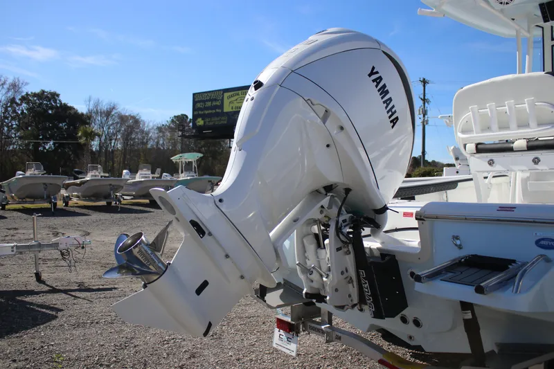 Slide: The Image of 2026 Tidewater 2300 Carolina Bay boat with Yamaha outboard motor in a sunny outdoor setting. - 32