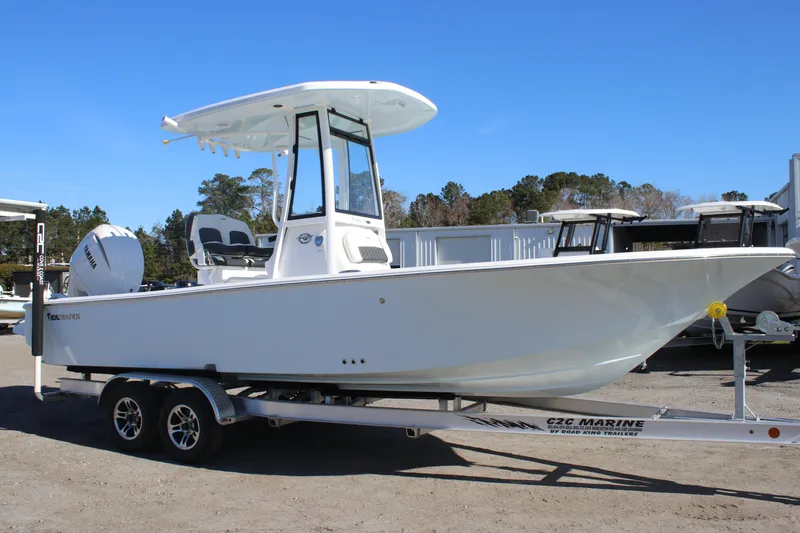 Slide: The Image of 2026 Tidewater 2300 Carolina Bay boat on trailer, side view, clear sky background. - 8