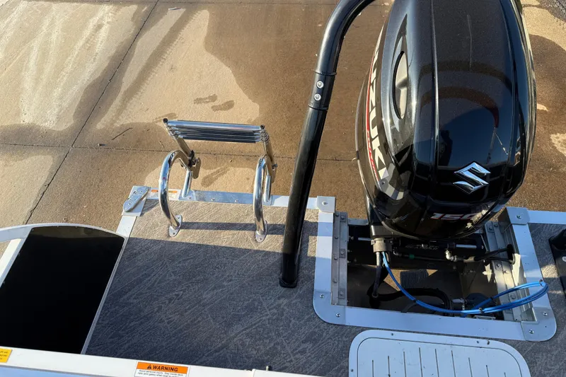 Slide: The Image of 2021 JC Spirit 221TT boat with Suzuki outboard motor and ladder on deck. - 30