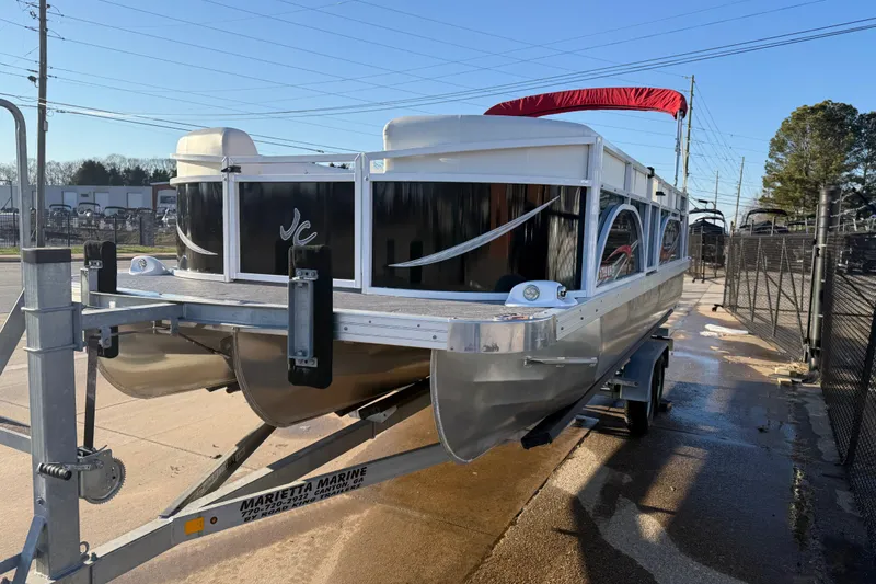Slide: The Image of 2021 JC Spirit 221TT pontoon boat on trailer at Marietta Marine dealership. - 4