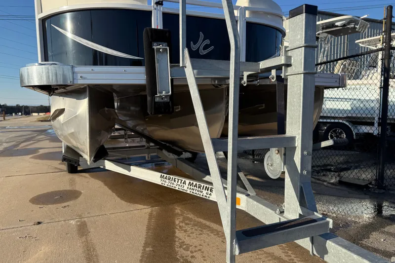 Slide: The Image of 2021 JC Spirit 221TT pontoon boat on trailer at Marietta Marine. - 2