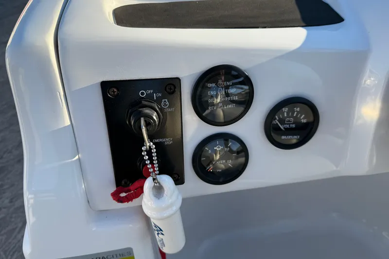 Slide: The Image of Control panel of 2021 JC Spirit 221TT boat with gauges and ignition switch. - 21