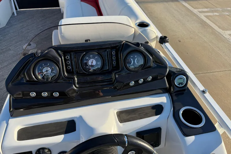 Slide: The Image of Dashboard of 2021 JC Spirit 221TT boat with gauges and controls. - 25