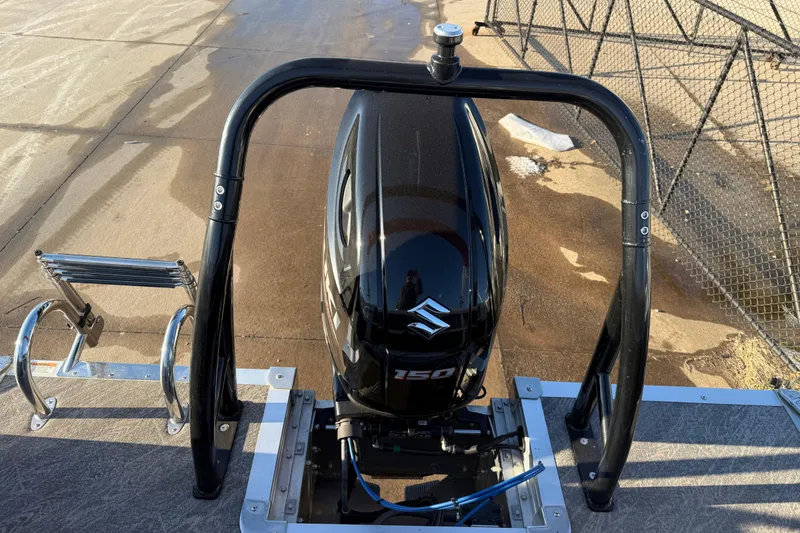 Slide: The Image of 2021 JC Spirit 221TT boat with Suzuki 150 outboard motor and ladder. - 29