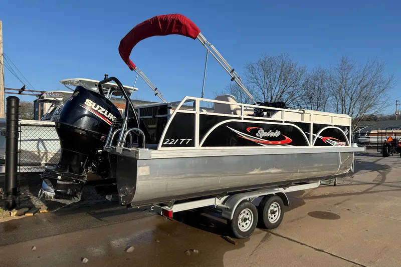 Slide: The Image of 2021 JC Spirit 221TT pontoon boat with Suzuki outboard motor on trailer. - 7