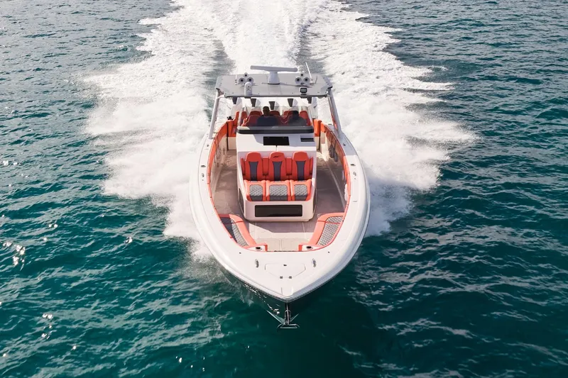 Slide: The Image of Midnight Express 43 Open boat cruising on open water, showcasing sleek design and speed. - 2