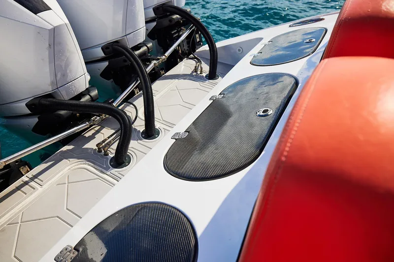 Slide: The Image of Midnight Express 43 Open boat deck with dual engines and red seating. - 22